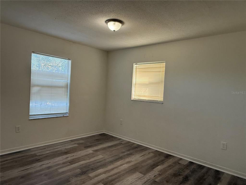 2213 Northwest 24th Road Ocala, FL 34475 - Photo 6 of 6 an empty room with a window