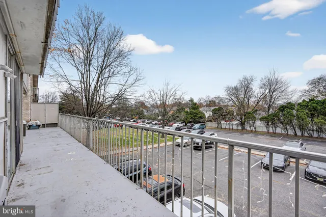 a view of a balcony with wooden fence