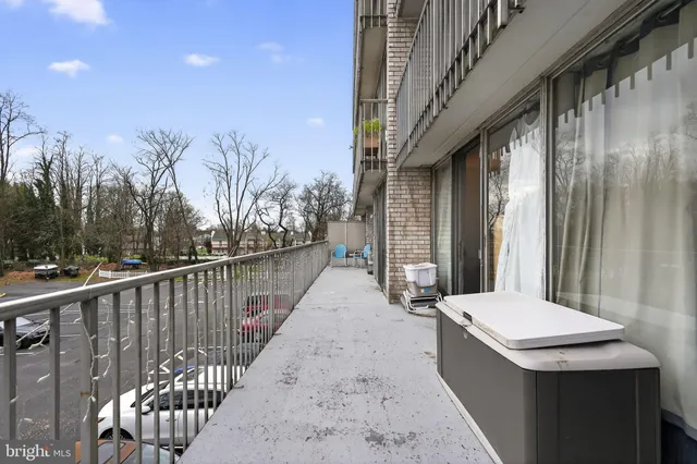 a view of balcony with wooden floor and fence