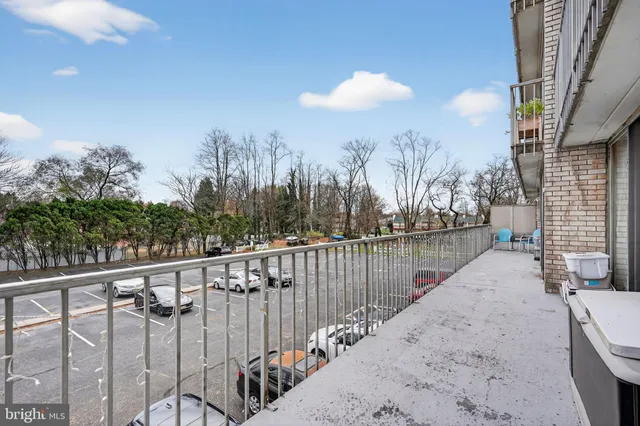 a view of a terrace with trees in the background