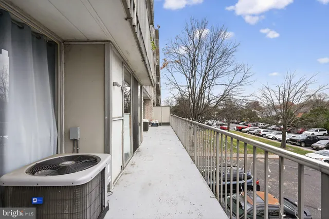 a balcony and view of a house with backyard of the house