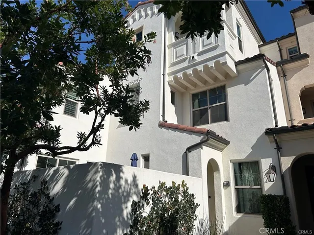 a view of a house with a tree