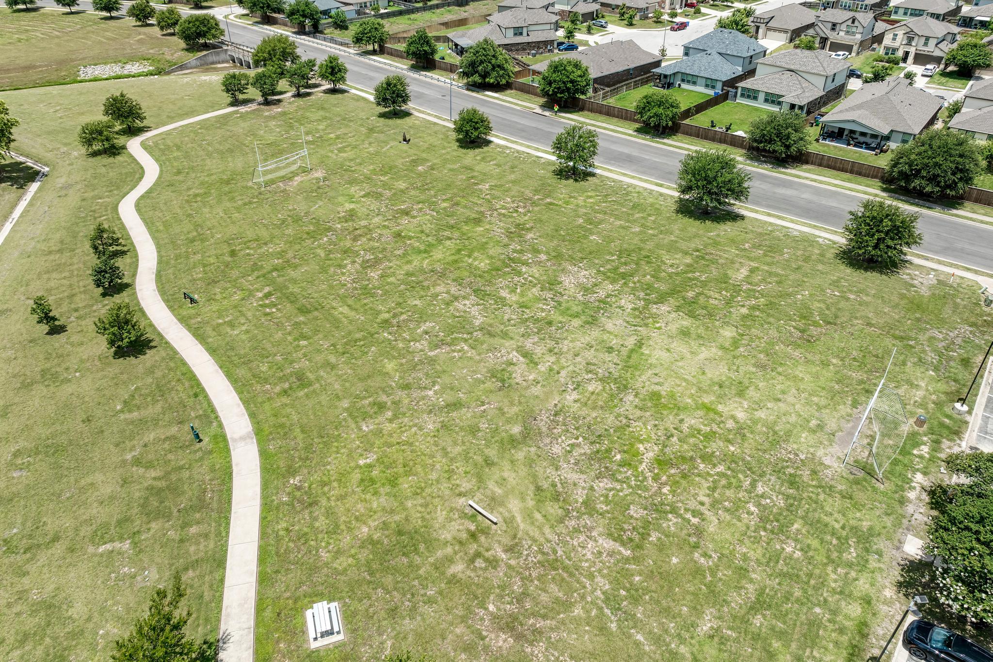 18308 Shallow Pool Drive Pflugerville, TX 78660 - Photo 37 of 40 Soccer field! Or space to throw a football or setup a volleyball net!