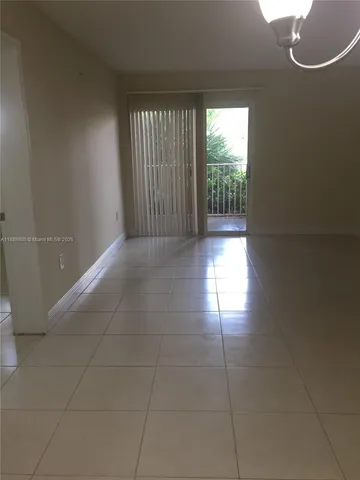 a view of empty room with windows