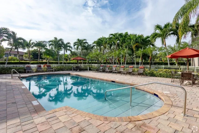 a view of a swimming pool with a patio
