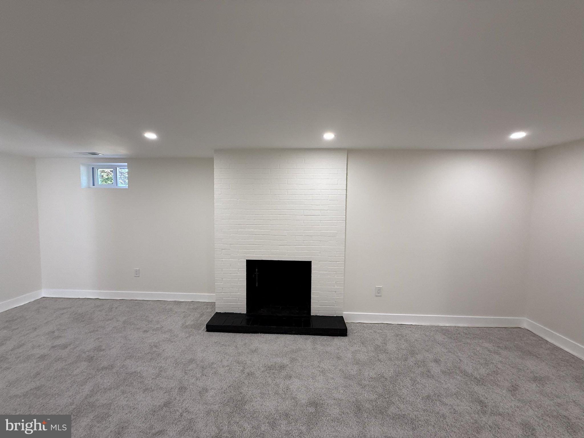 103 Stoneleigh Road Bel Air, MD 21014 - Photo 5 of 45 Cozy, modern space with a fireplace.