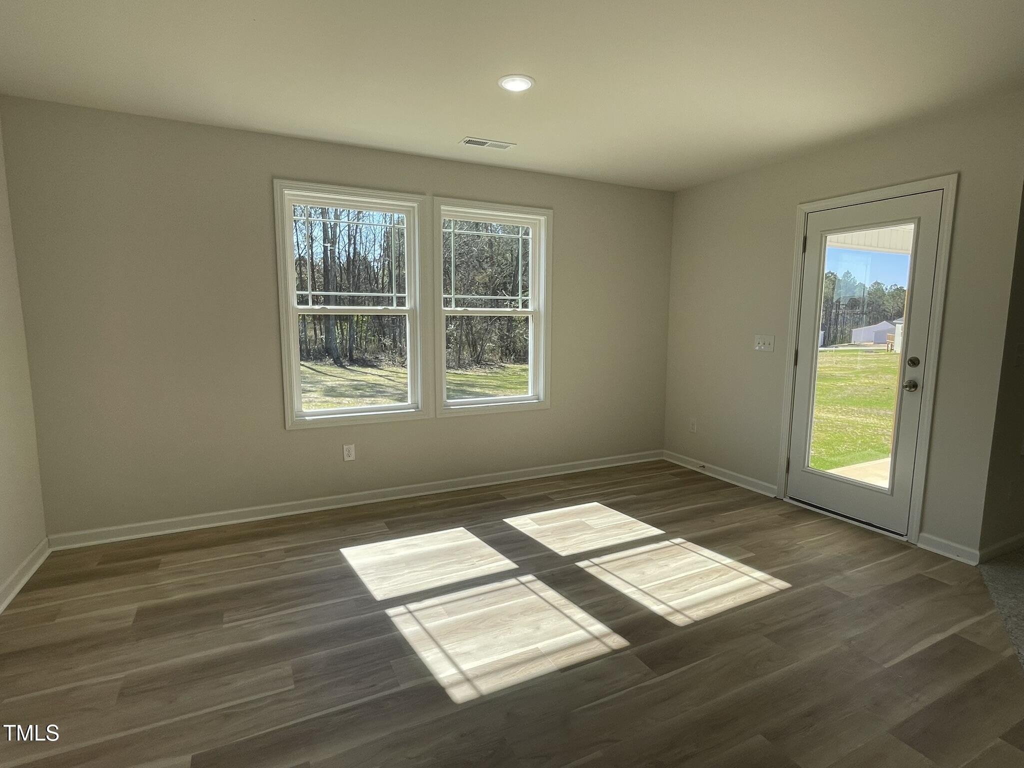 111 Magnolia Run Way Benson, NC 27504 - Photo 6 of 18 a view of an empty room and window