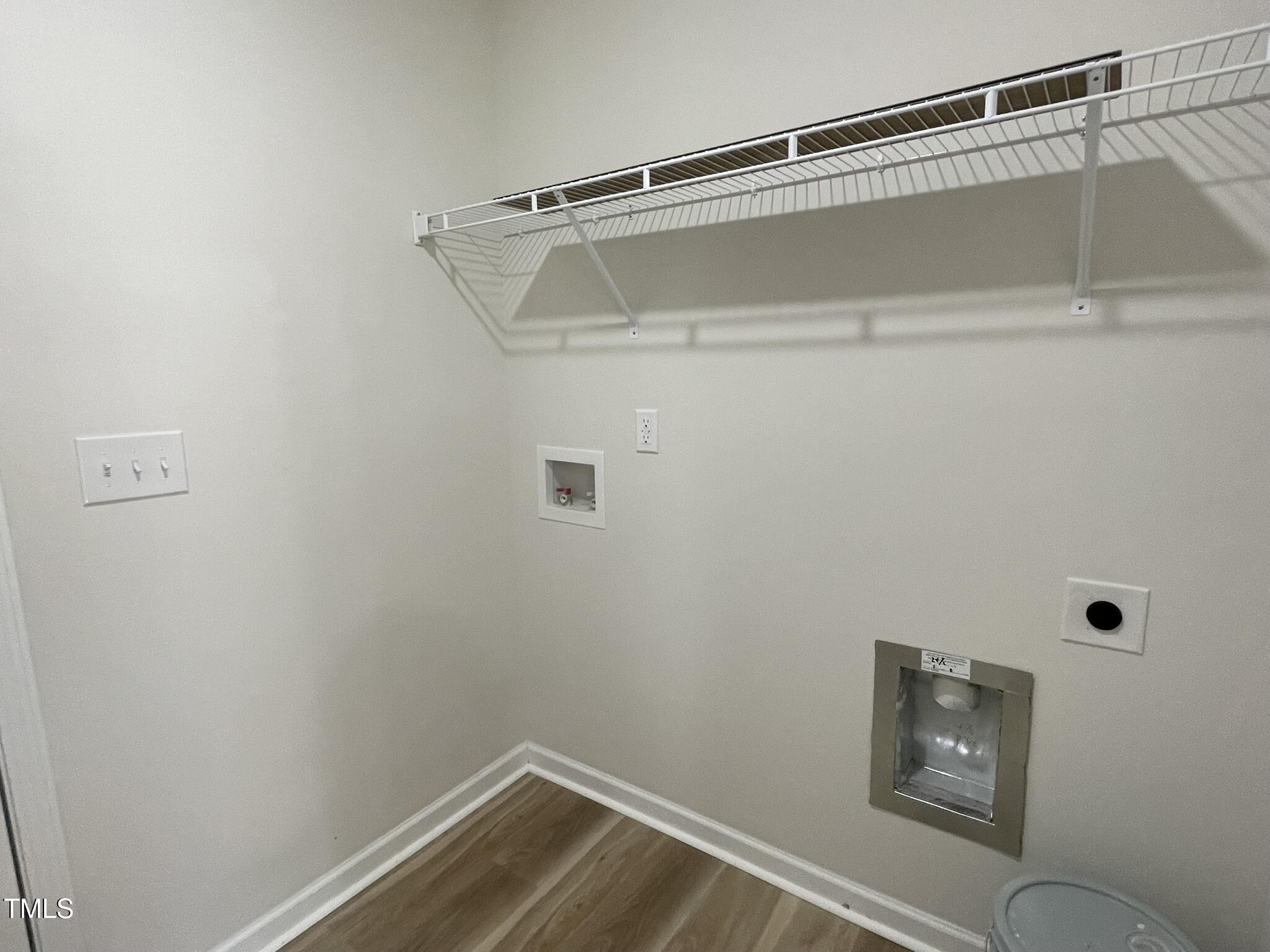 111 Magnolia Run Way Benson, NC 27504 - Photo 7 of 18 a view of small space with racks on the wall