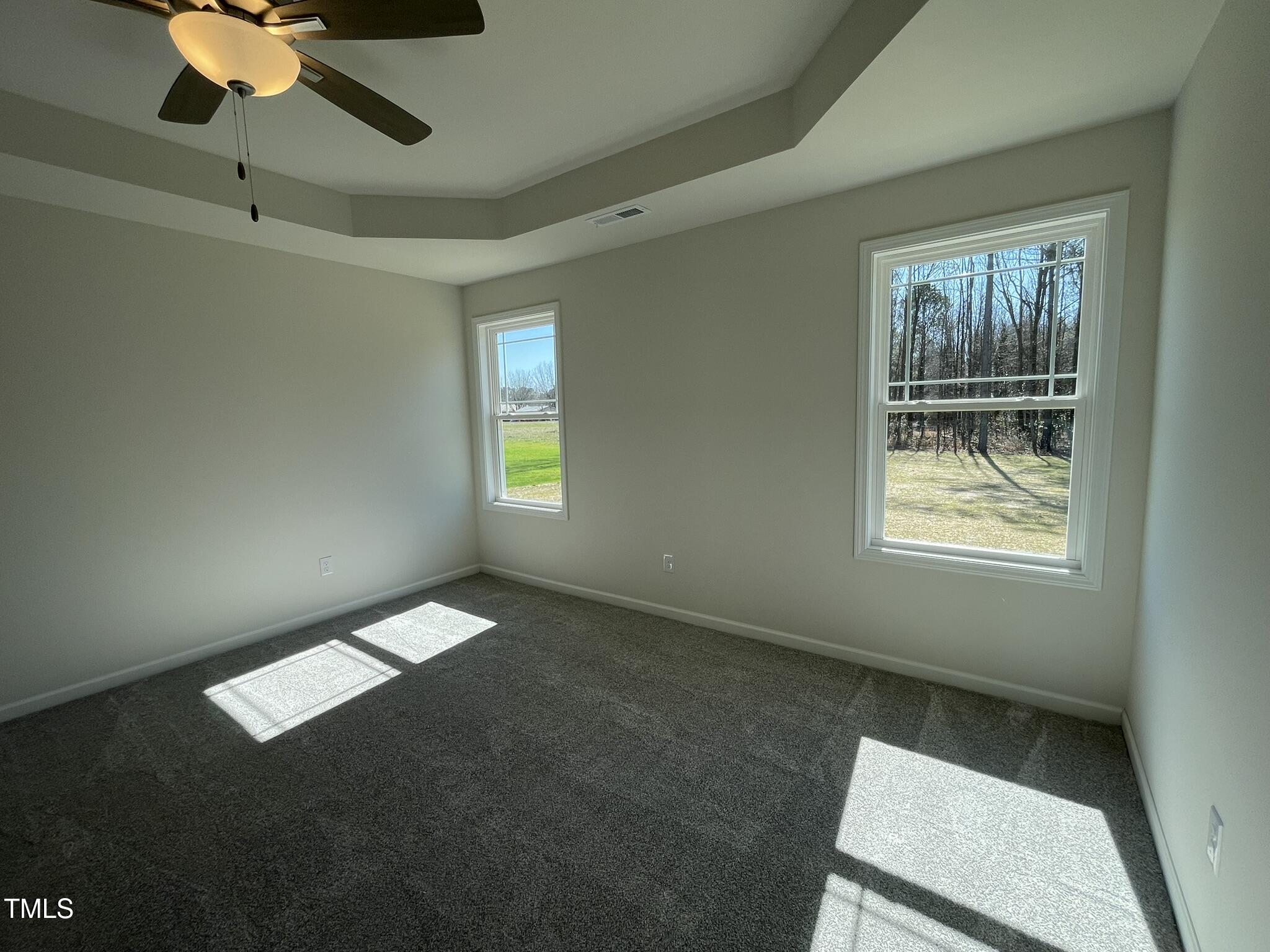 111 Magnolia Run Way Benson, NC 27504 - Photo 10 of 18 a view of an empty room with a window