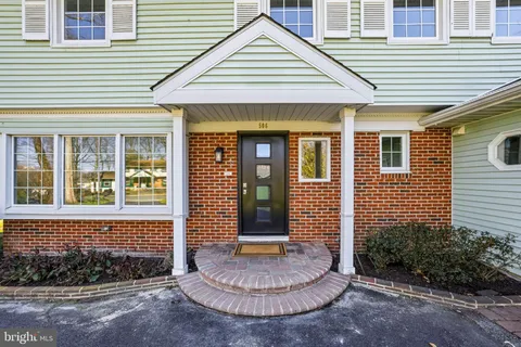 a view of a brick house with a large windows