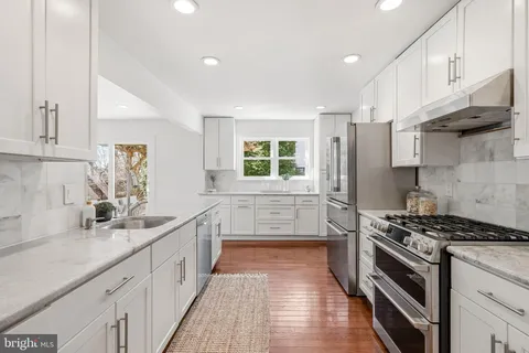 a bathroom with a sink toilet and a mirror
