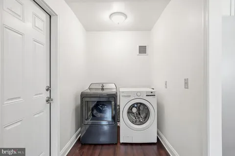 a bathroom with a shower and a bath tub