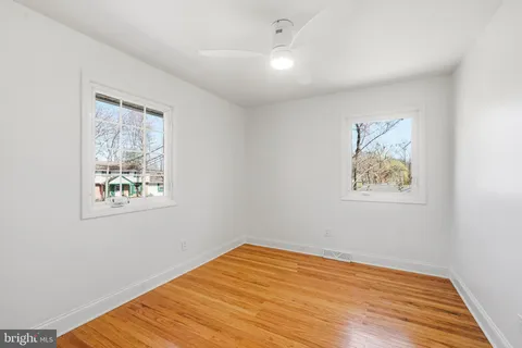 a bathroom with a shower a toilet and a sink