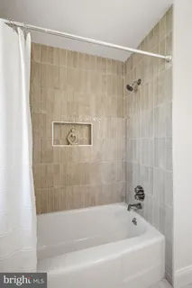 a view of walk in closet with wooden floor
