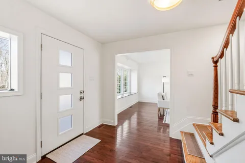 a view of entryway with wooden floor
