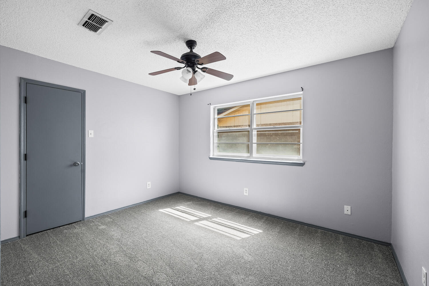 4809 72nd Street Lubbock, TX 79424 - Photo 22 of 34 a view of an empty room with a window