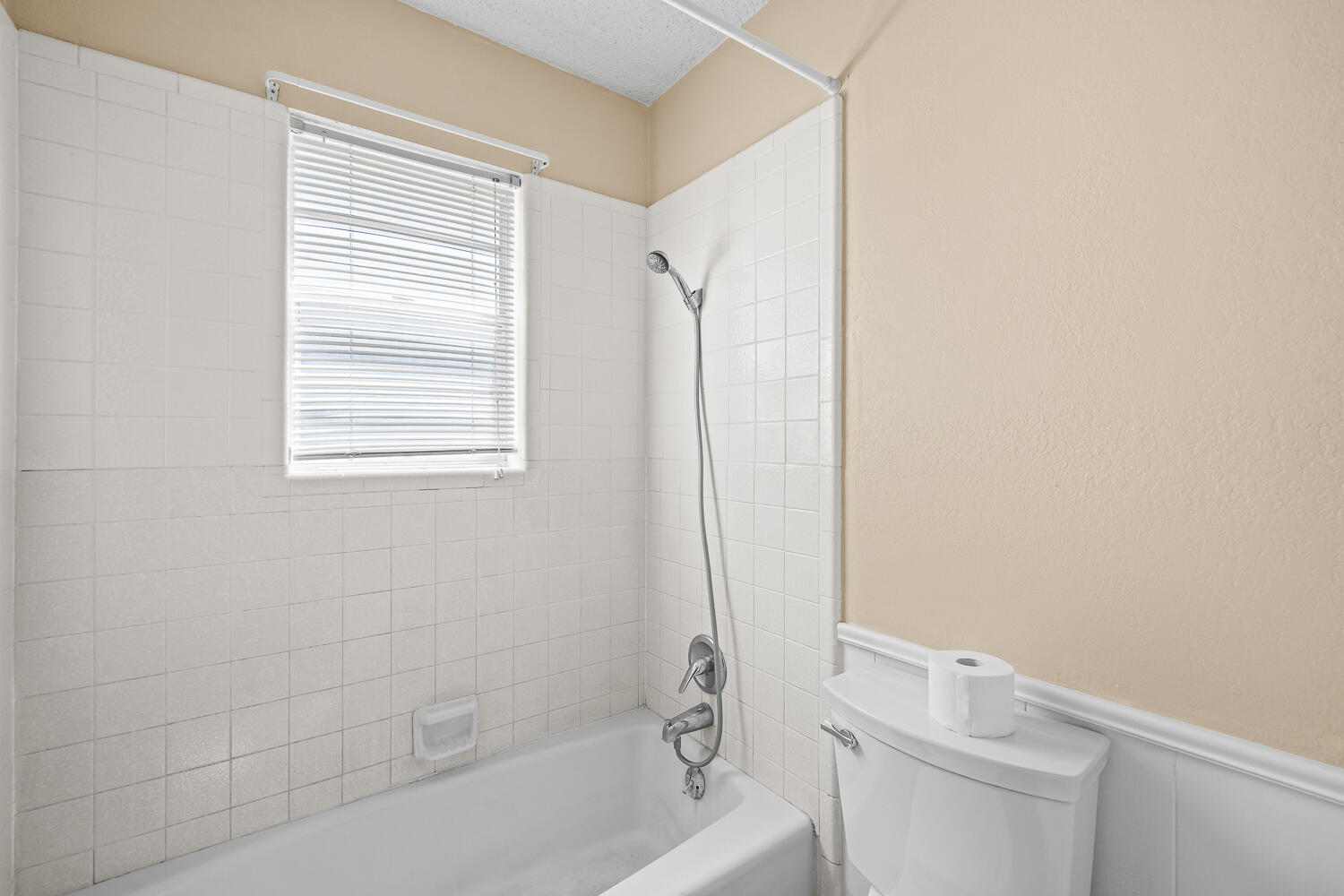 4809 72nd Street Lubbock, TX 79424 - Photo 25 of 34 a white bath tub sitting next to a white toilet