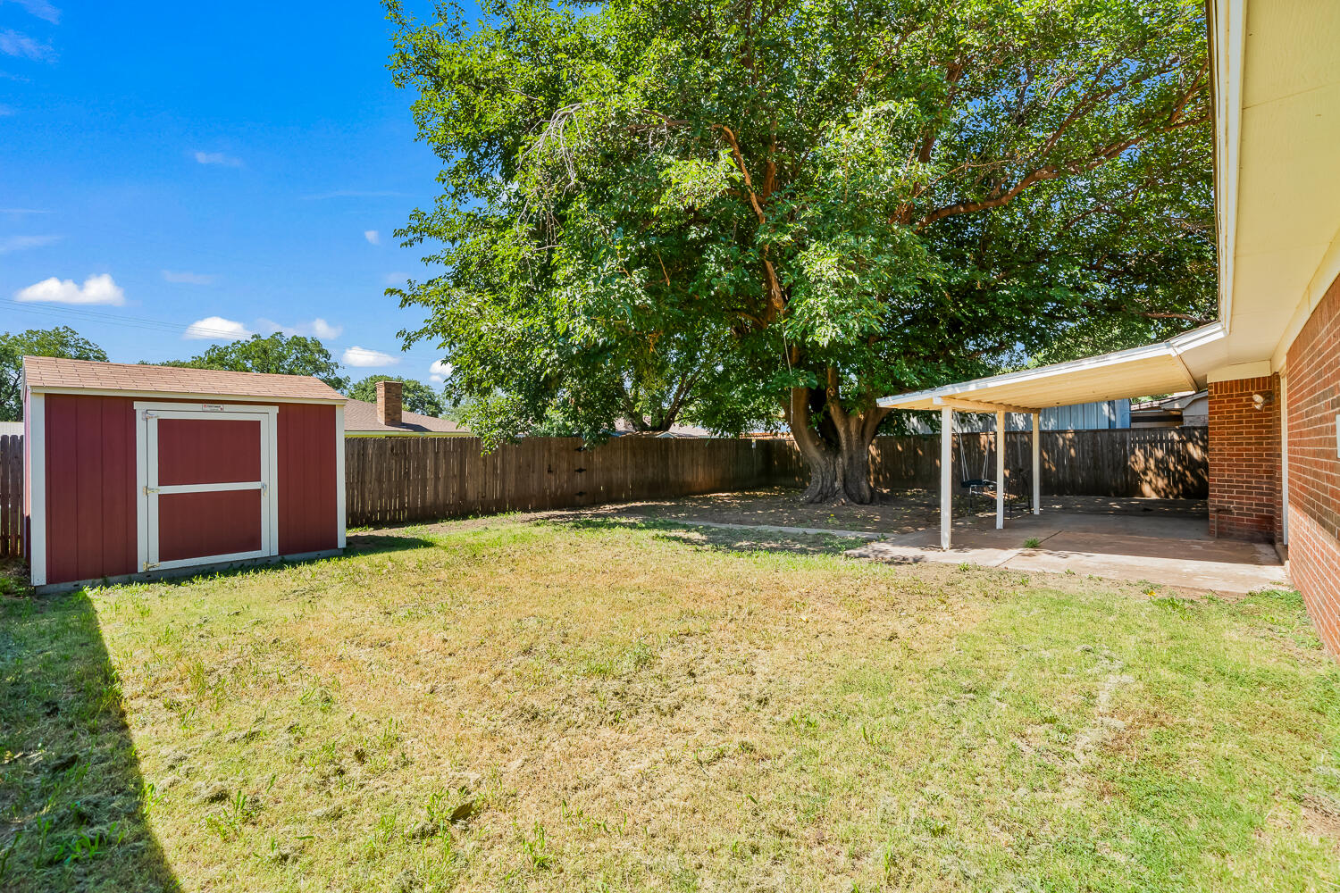 4809 72nd Street Lubbock, TX 79424 - Photo 30 of 34 a view of a house with a yard