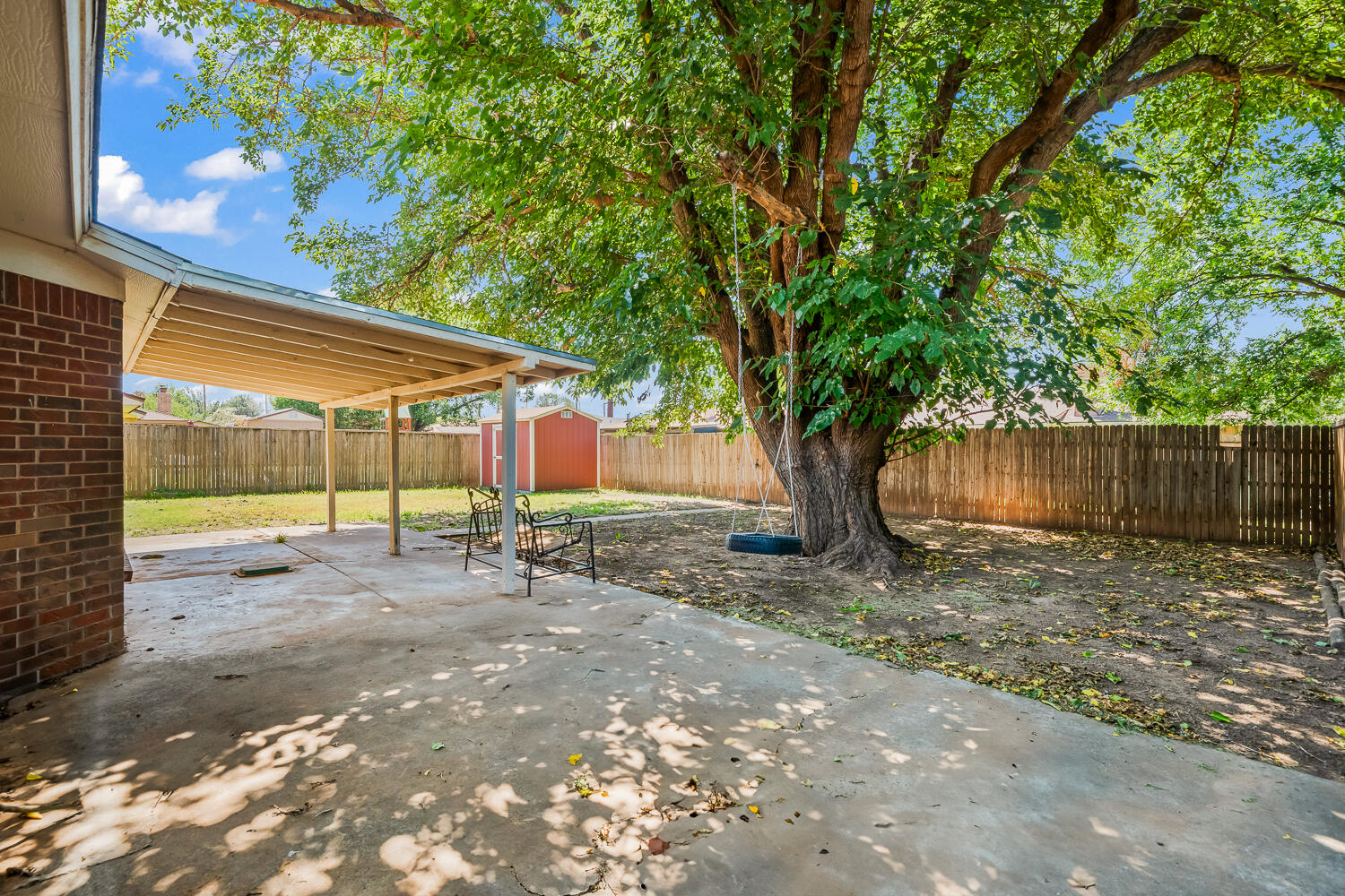 4809 72nd Street Lubbock, TX 79424 - Photo 34 of 34 a view of a house with backyard and a tree