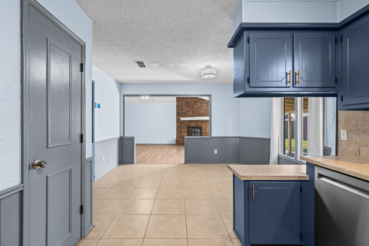 4809 72nd Street Lubbock, TX 79424 - Photo 9 of 34 a kitchen with stainless steel appliances granite countertop a refrigerator and a sink