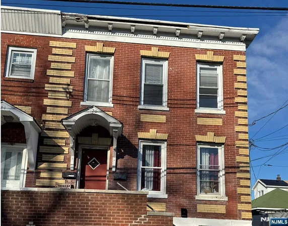 a front view of a building with glass windows