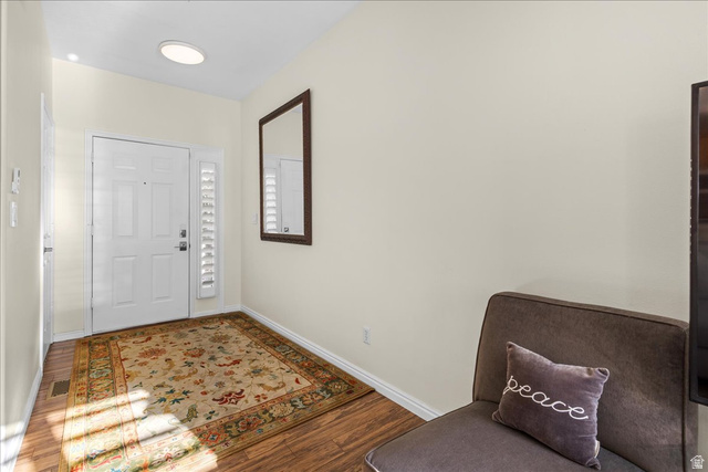 7824 South Sequoia Tree Lane Sandy, UT 84094 - Photo 4 of 43 Foyer with wood finished floors and baseboards