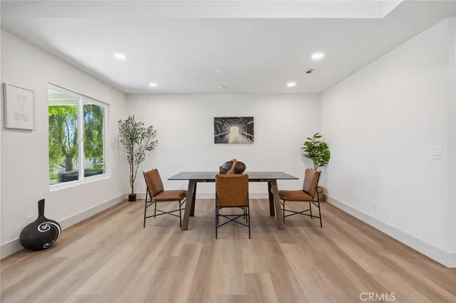 a bedroom with a bed and a window with outer view