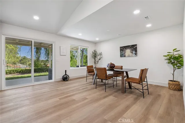 a work room with furniture and a large window