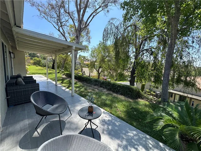 a view of balcony with wooden floor and outdoor space