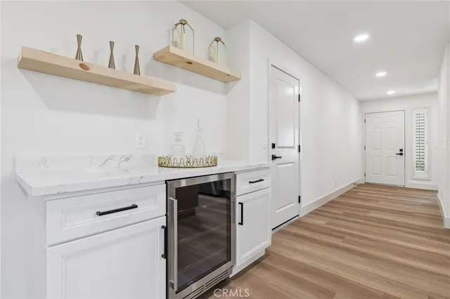 a kitchen with kitchen island stainless steel appliances a sink stove and cabinets