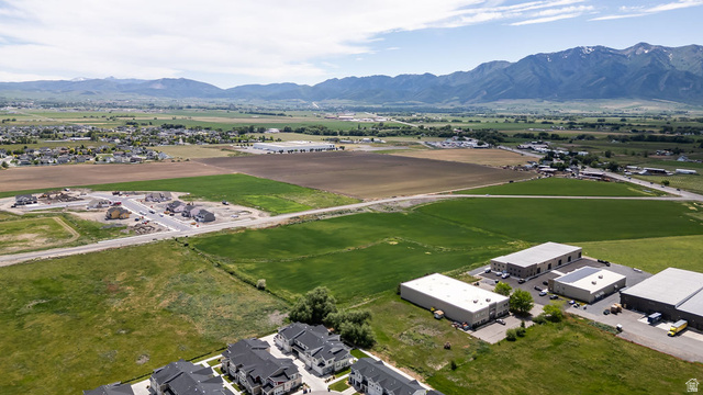 2483 South 1296th Street West Logan, UT 84321 - Photo 37 of 45 Expansive green fields with distant mountains and established residential areas