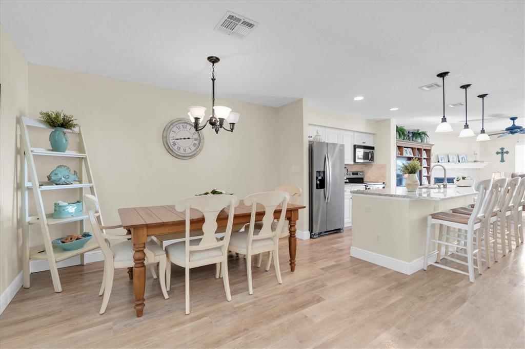 641 Garland Circle Indian Rocks Beach, FL 33785 - Photo 16 of 50 a dining room with wooden floor and breakfast area