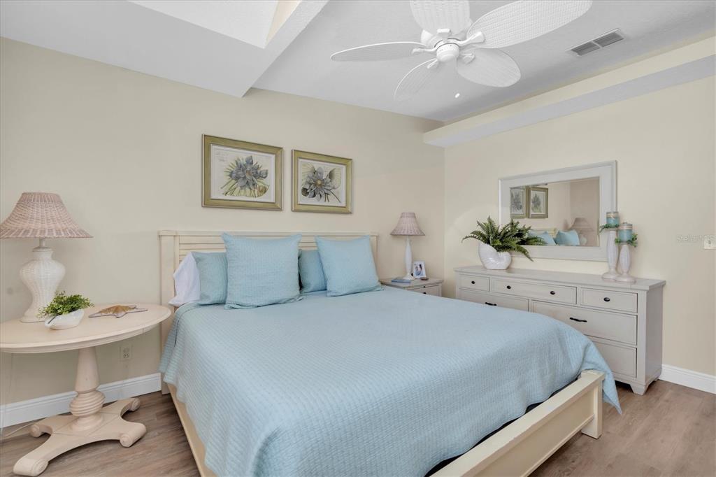 641 Garland Circle Indian Rocks Beach, FL 33785 - Photo 18 of 50 a bedroom with a bed and a table in it