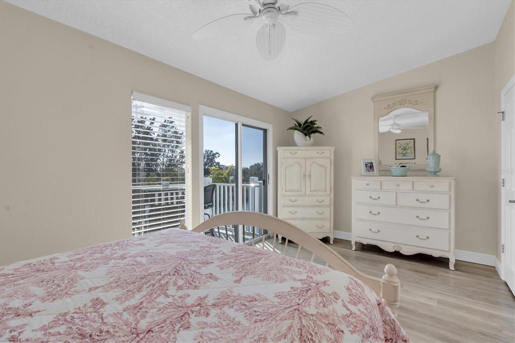 641 Garland Circle Indian Rocks Beach, FL 33785 - Photo 22 of 50 a bedroom with a bed and a window