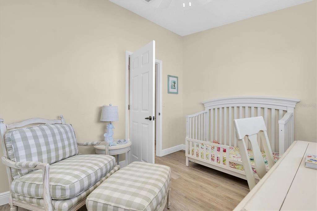 641 Garland Circle Indian Rocks Beach, FL 33785 - Photo 26 of 50 a living room with furniture and a baby crib