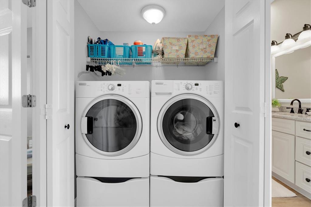 641 Garland Circle Indian Rocks Beach, FL 33785 - Photo 27 of 50 a kitchen with a washer and dryer