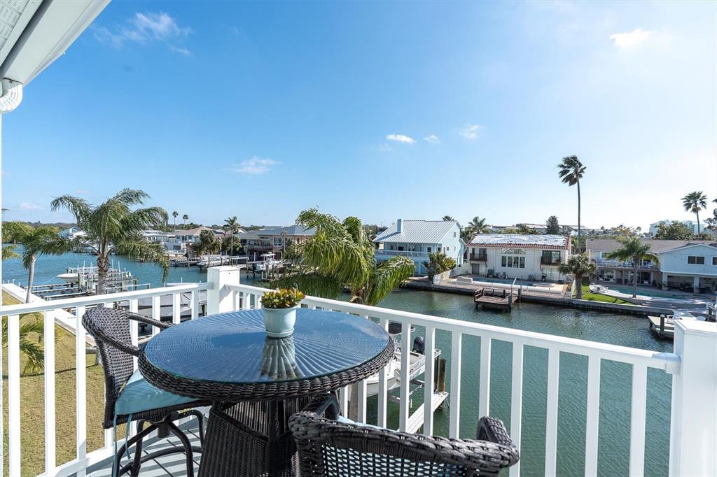 641 Garland Circle Indian Rocks Beach, FL 33785 - Photo 28 of 50 a balcony with a table and chairs