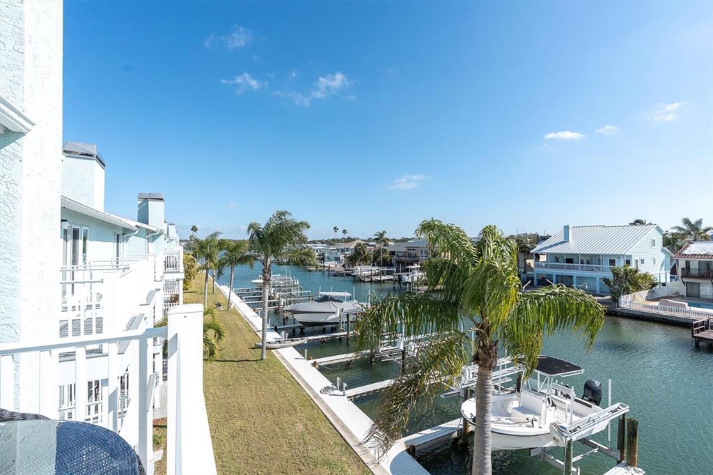 641 Garland Circle Indian Rocks Beach, FL 33785 - Photo 29 of 50 a view of swimming pool with outdoor seating and plants