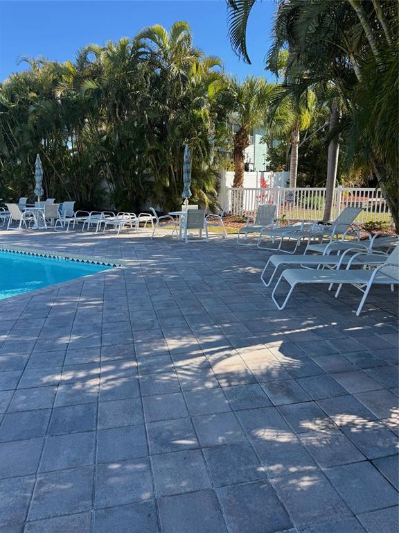 641 Garland Circle Indian Rocks Beach, FL 33785 - Photo 44 of 50 a view of a yard with table and chairs
