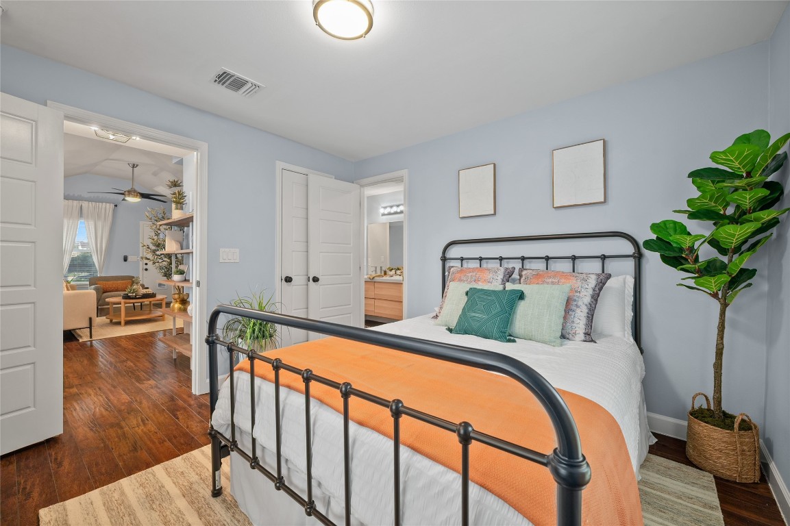 1191 Chicon Street Austin, TX 78702 - Photo 15 of 33 Primary bedroom featuring dark wood finished floors and ensuite bathroom