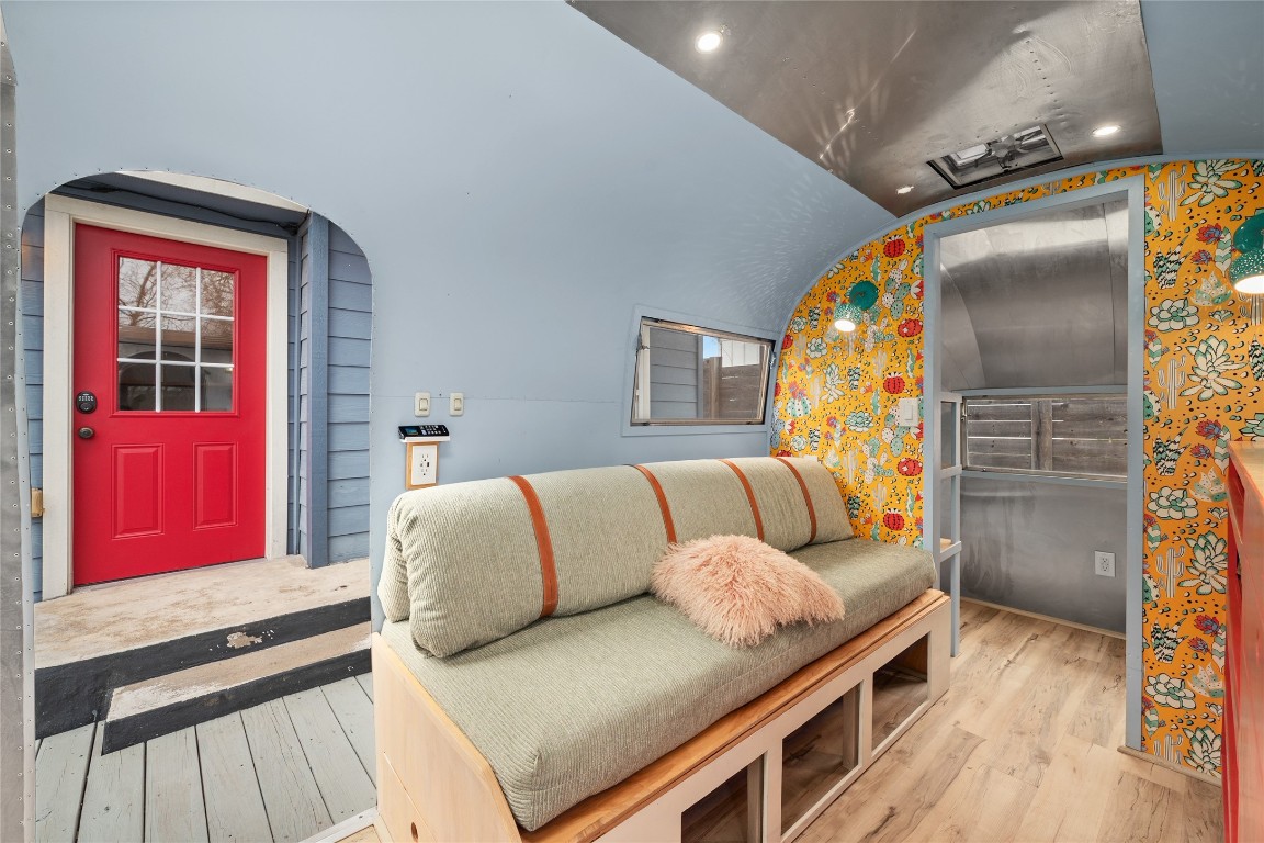 1191 Chicon Street Austin, TX 78702 - Photo 23 of 33 Inside the Airstream, you'll find a thoughtfully designed interior featuring cozy seating, built-in storage, and ample counter space—perfect for an office, guest quarters, or lounge. Don’t miss how light and modern finishes make the space feel surprisingly spacious.