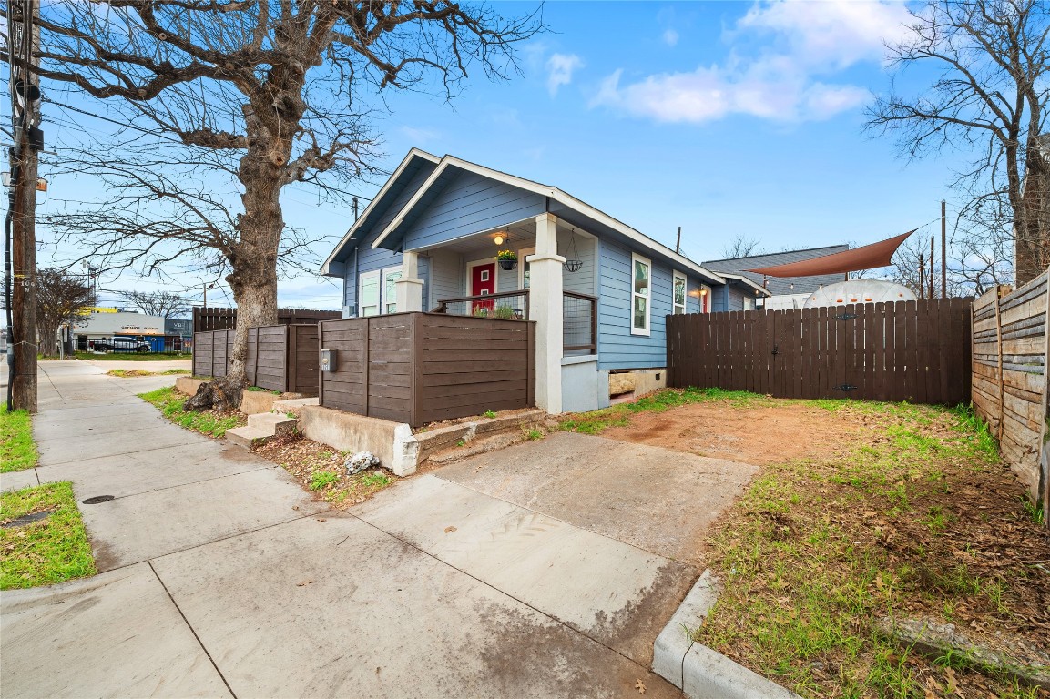 1191 Chicon Street Austin, TX 78702 - Photo 28 of 33 View of side of home featuring a fenced front yard and covered porch