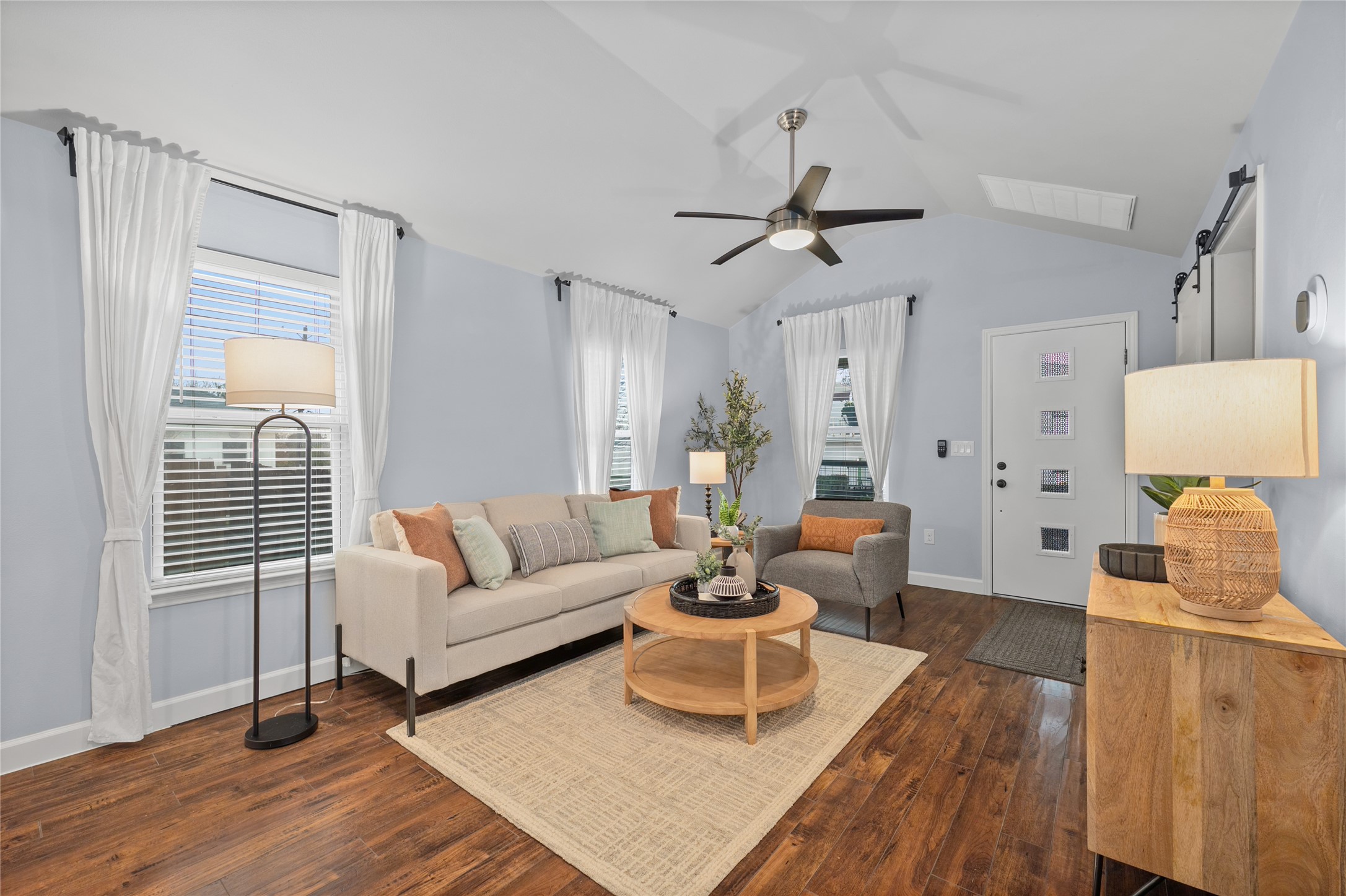 1191 Chicon Street Austin, TX 78702 - Photo 6 of 33 a living room with furniture a wooden floor and a large window
