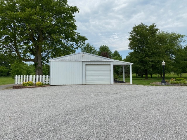 11426 East Radisson Road Mount Vernon, IL 62864 - Photo 37 of 56 a view of a house with a yard and large tree