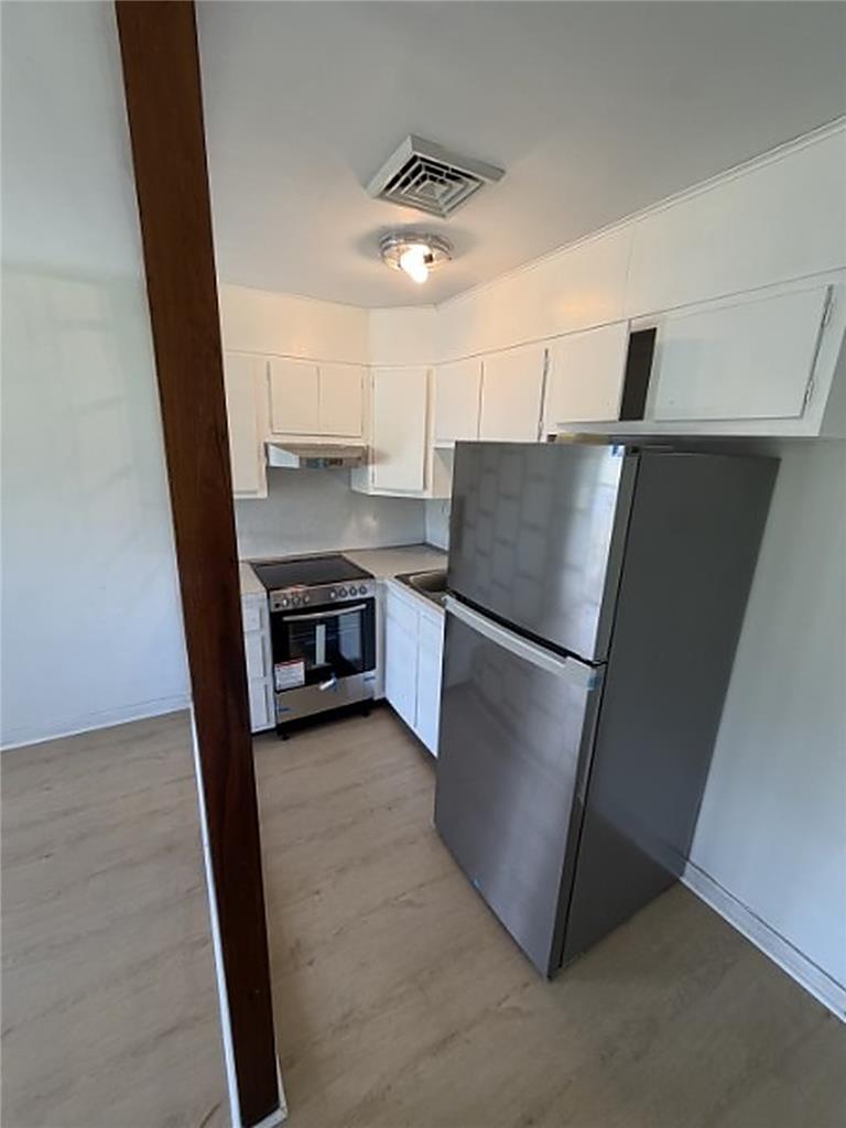 5391 Chapmans Road, Unit 1 Orefield, PA 18069 - Photo 4 of 7 A well-appointed kitchen features modern appliances and clean, functional cabinetry.