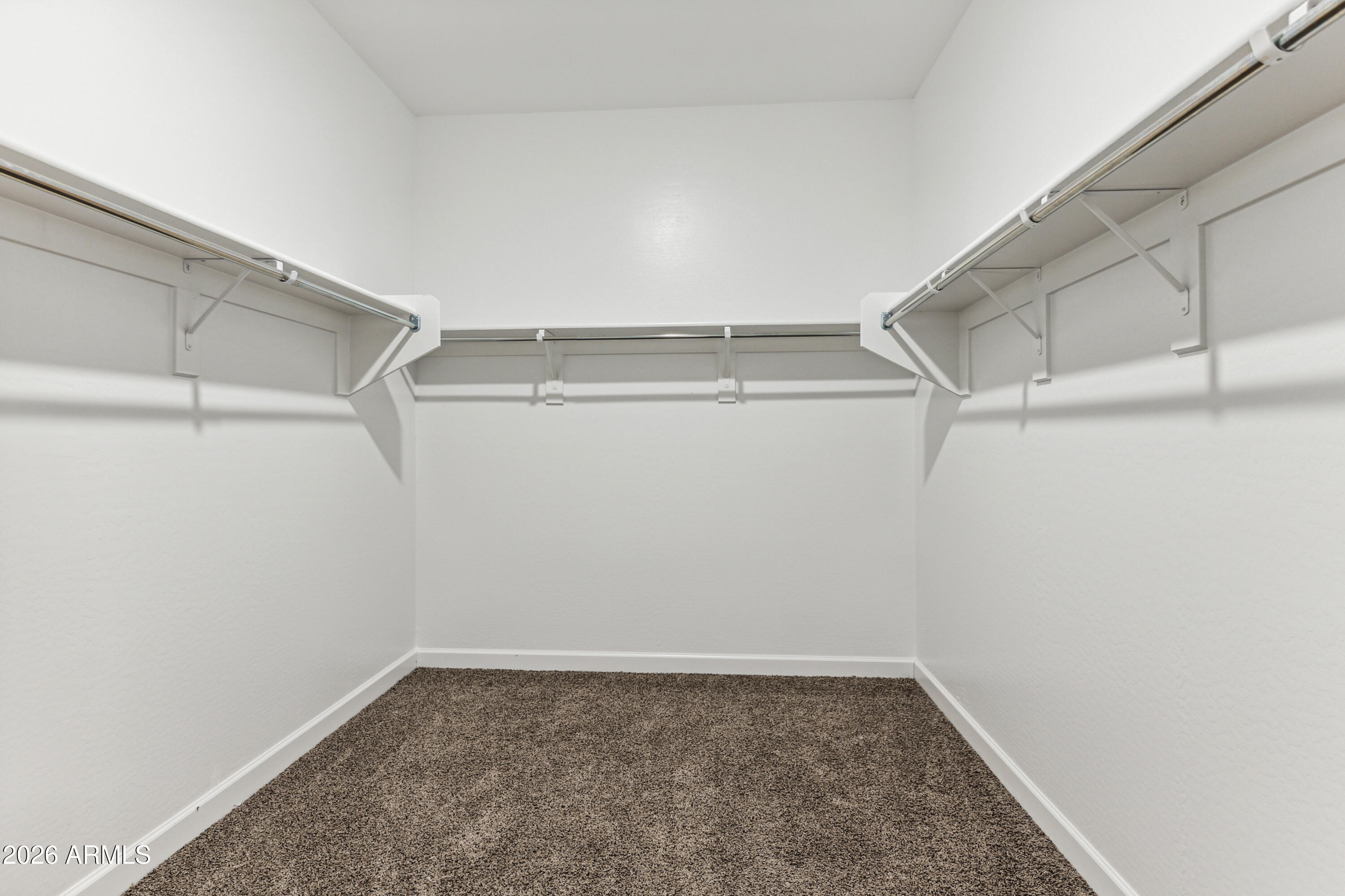 17885 North Ravello Road Maricopa, AZ 85138 - Photo 12 of 35 a view of a room with racks on the wall