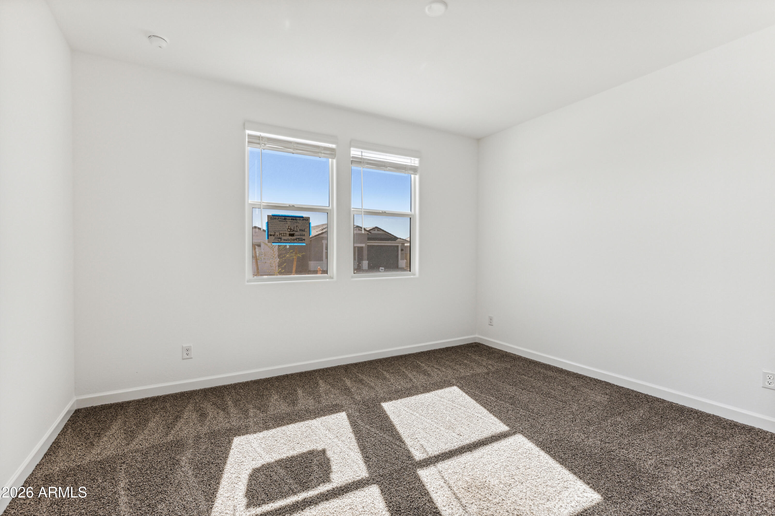 17885 North Ravello Road Maricopa, AZ 85138 - Photo 17 of 35 a view of an empty room with a window