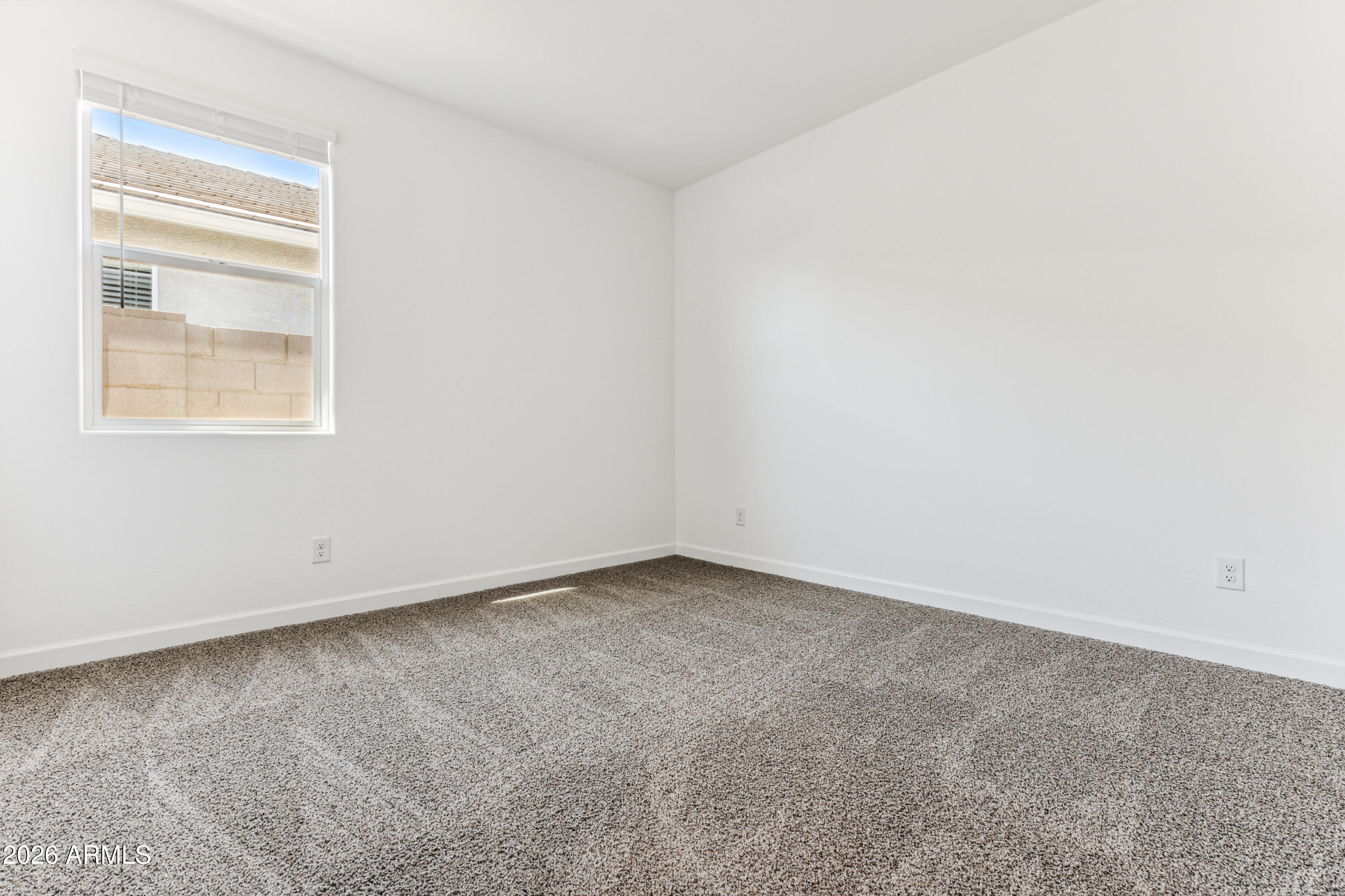 17885 North Ravello Road Maricopa, AZ 85138 - Photo 19 of 35 an empty room with a window