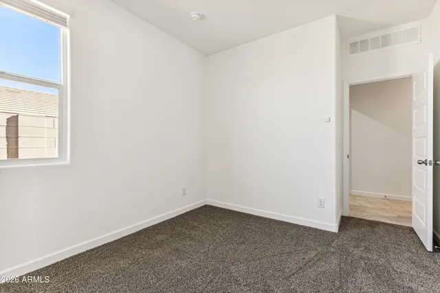 an empty room with a bathroom