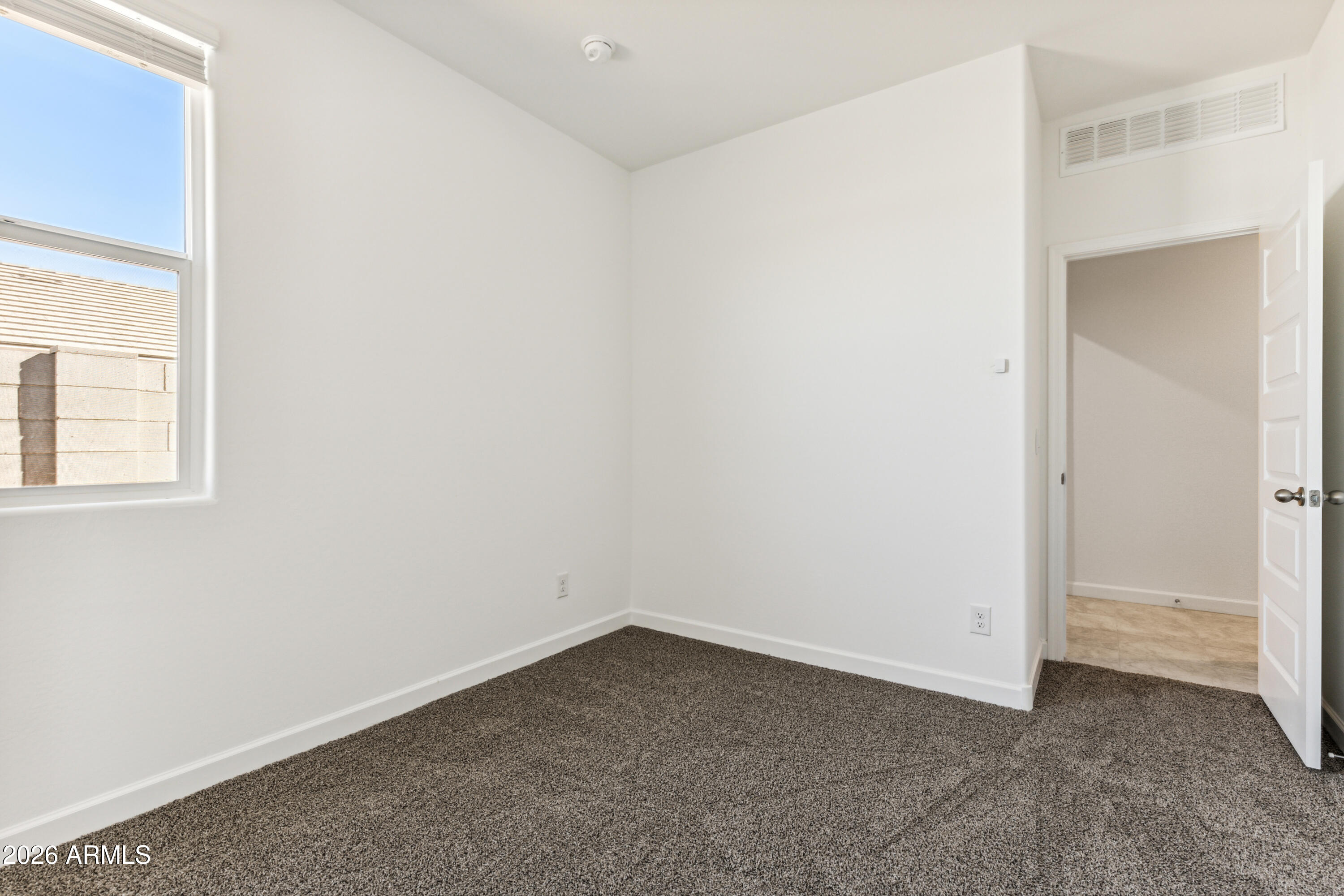 17885 North Ravello Road Maricopa, AZ 85138 - Photo 21 of 35 an empty room with a bathroom